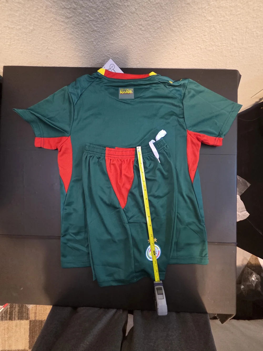 Puma Kids Green Jersey and Shorts Set with Red & Yellow Accents